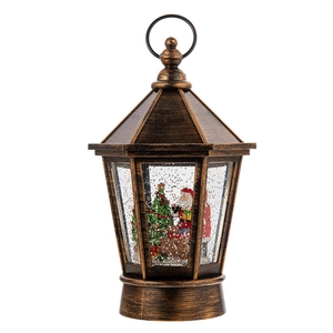 Vintage bronze Christmas lantern with Santa Claus and sparkling snow scene in water