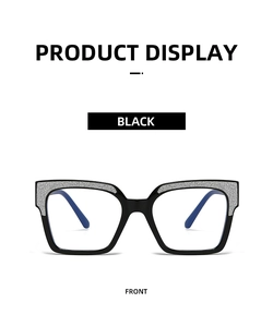 Front view of black anti-blue light glasses with silver glitter accents on the frame