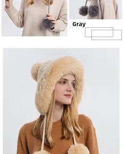 Detailed view of winter knit beanie with soft faux fur lining and plush pom poms