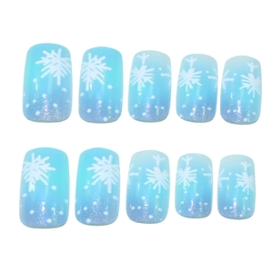 Unghie finte blu sfumato con motivi a fiocco di neve bianchi e glitter argentati