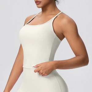 Close-up of high-elasticity cream white sports tank top and yoga leggings set