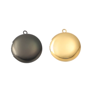 Detailed view of round 316L stainless steel photo lockets in gold and black mirror finish