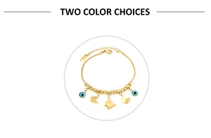 Detail view of a gold-plated butterfly bracelet with blue Evil Eye charms and fine snake chain