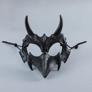 Macro detail of black demon half mask with textured finish and horn design for Halloween