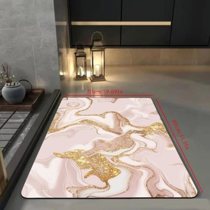 Detail of pink gold marble bath mat measuring 50x80cm on a modern dark grey floor