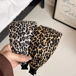 Wide leopard print headbands in light and dark patterns for stylish hair styling