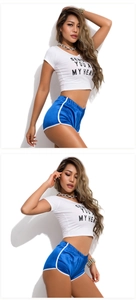 Side and back view of white printed T-shirt and blue athletic shorts set for women
