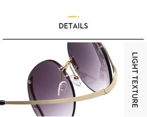 Detail of metal hinge and gradient purple lens on rimless oversized sunglasses