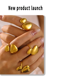 Detail of 18K gold plated stainless steel rings with organic pebble-shaped design