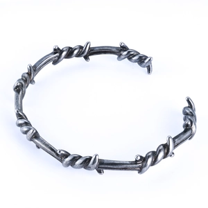 Detailed view of stainless steel thorn bracelet with vintage punk wire design