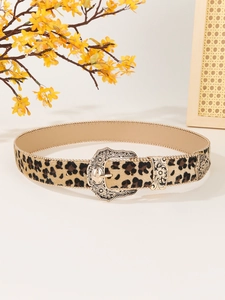 Detail of leopard print belt with vintage gold carved buckle and beaded chain edge