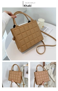 Close-up of khaki square handbag with 3D embossed lattice texture and golden hardware
