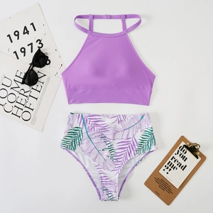 Detail view of purple halter top and high-waisted tropical palm leaf print bikini set