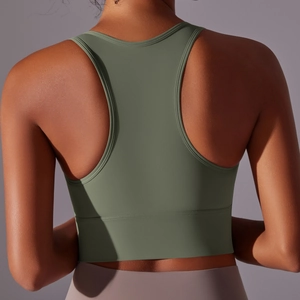 Detailed back view of a sage green racerback sports bra with seamless elastic fabric