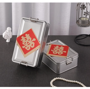 Detail of silver rectangular tin box with metal latch and red double happiness sticker