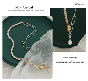 Detail of a split chain necklace featuring cubic zirconia links and a pearl pendant