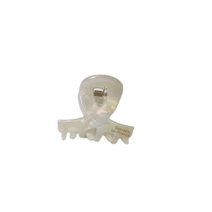 Elegant white acetate bow hair claw clip with golden Barrette La France lettering