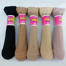 Detailed flat lay of multi-color coral fleece socks with pink labels and cartoon embroidery