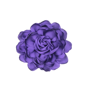 Close-up of purple satin rose fabric flower with detailed multi-layered petals texture