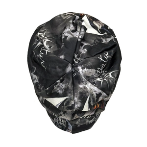 Detail of street style beanie with black and white abstract print and Natural text