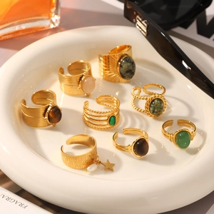 Set of eight gold stainless steel adjustable rings with natural stones and pearls