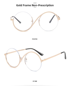 Detail of gold metal round frames with unique S-shaped nose bridge and clear lenses