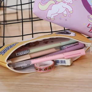 Detailed view of large capacity yellow astronaut pencil case with items inside