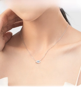 Close-up of S925 silver Evil Eye pendant necklace with blue stone and white zircons