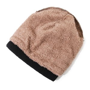 Winter knitted beanie for women featuring black ribbed hem and brown plush top section