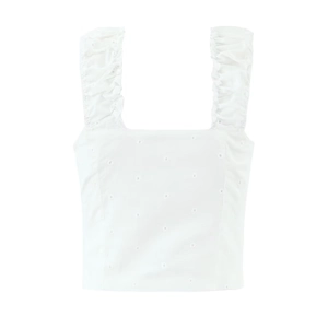 White crop tank top with ruffle wide straps and hollow embroidery on a white background