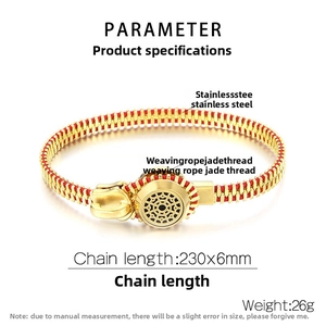 Macro detail of red woven rope bracelet with gold stainless steel industrial zipper links
