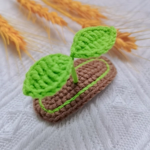 Handmade crochet green sprout hair clip for girls with cute 3D knit plant design