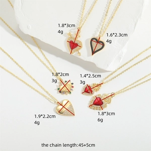 Set of six trendy gold heart pendant necklaces with colorful enamel and crystal details