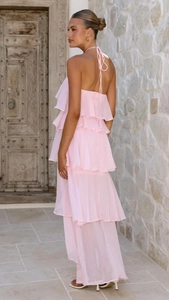 Detail of pink halter tiered chiffon maxi dress showing layered ruffles and backless design