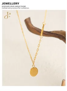 Macro detail of gold plated necklace with Good Luck engraved pendant and unique link chain