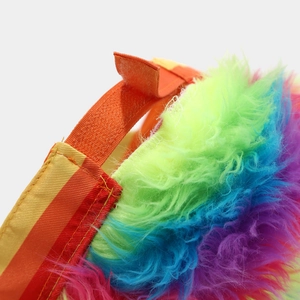 Detail of colorful rainbow wig hat featuring adjustable elastic strap and velcro closure