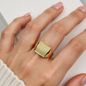 Detailed view of square 18K gold plated ring with micro-paved sparkling cubic zirconia
