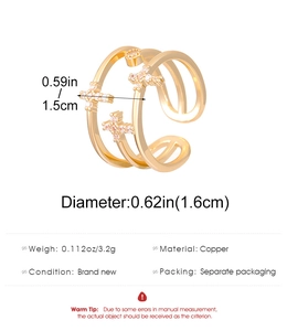 Detail view of gold layered ring dimensions 1.6cm diameter and star cross zircon design