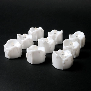 Set of 9 white LED flameless candles with realistic melted wax texture on black background
