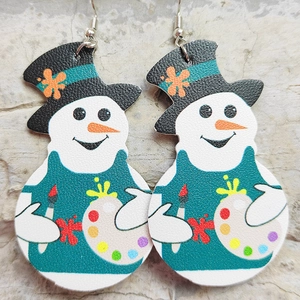 Detail of Christmas snowman earrings with textured leather material and hanging hooks