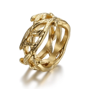 Detailed view of gold plated tree of life ring featuring intricate cut-out leaf patterns