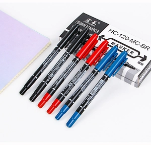 Detail shot of black red blue dual tip markers with thin nibs for drawing and marking