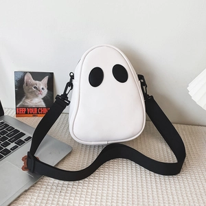 Detail of cute white ghost-shaped PU leather crossbody bag with wide black strap