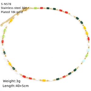 Close-up of colorful glass beads on an 18K gold plated stainless steel necklace
