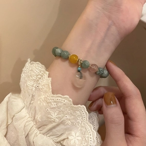 Elegant jade chalcedony beaded bracelet with peach pendant and delicate lace sleeve