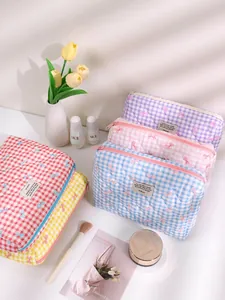 Quilted checkerboard cosmetic bags with bow prints in various pastel colors set of five