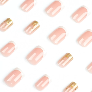 Unghie finte French rosa nude con glitter dorati e bordi bianchi in set completo