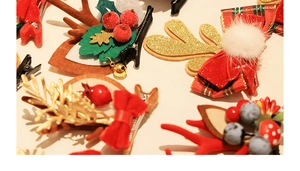 Detailed close-up of festive Christmas hair clips with reindeer antlers and mink fur