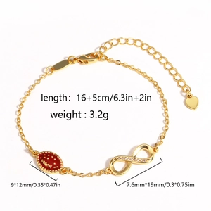 Detail von 14k Gold Unendlichkeitsarmband mit rotem Emaille-Anhänger und Kristallen