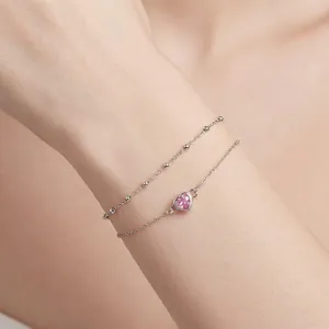 Double-layer 925 silver bracelet featuring pink heart zircon on female wrist